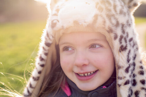 Portrait of shy little girl wearing hat with leopard print - NMSF00028