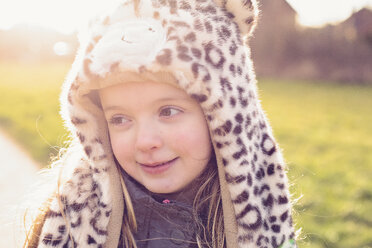 Portrait of shy little girl wearing hat with leopard print - NMSF00029