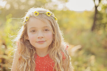 Portrait of relaxed little girl wearing flower wreath - NMSF00031