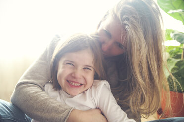Mother and daughter having fun at home - RTBF00766
