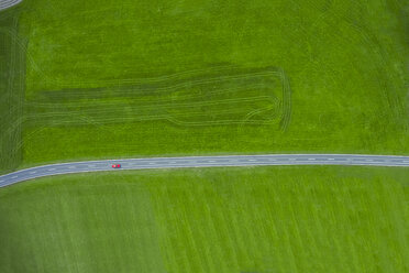 Fire engine driving on country road, aerial view - MMAF00060