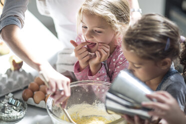 Mother and girls baking in kitchen - ZEF13225