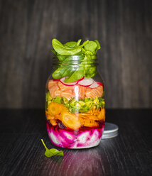 Preserving jar of salad with vegetables and salmon - KSWF01798