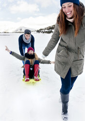 Three friends having fun in the snow - MGOF03130