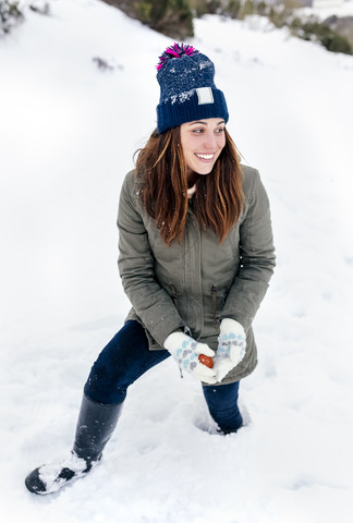 Smiling young woman the snow stock photo