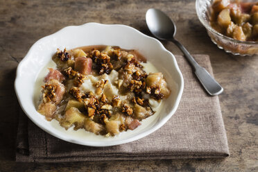 Bowl of porridge with rhubarb compote, honey and nuts - EVGF03158