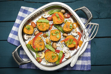 Raw vegetables and herbs in a pan - MAEF12181