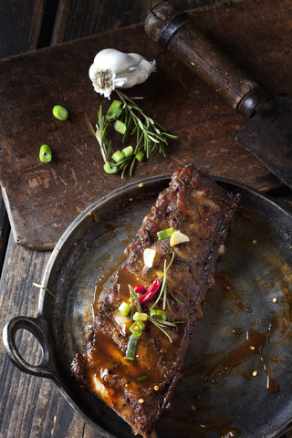 Marinated and grilled spare ribs with Barbecue sauce in roasting tray stock photo