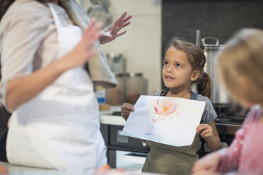 Family cooking together in kitchen - ZEF13305