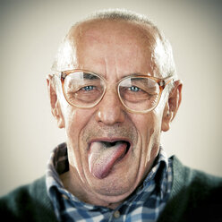 Portrait of an elderly man, sticking his tongue out - ZOCF00175