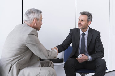 Business partners having a meeting, shaking hands - DIGF01551