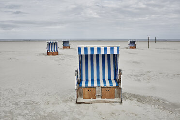 Germany, Schleswig-Holstein, St Peter-Ording, hooded beach chair - RORF00710