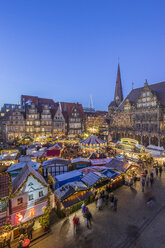 Germany, Bremen, Christmas market on market square in the evening seen from above - PVCF01063