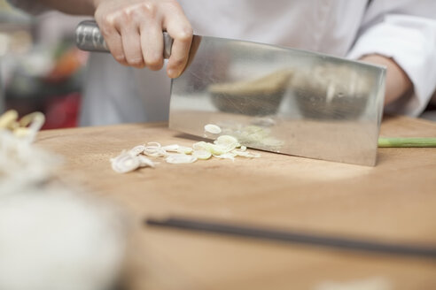 Close-up of chef chopping spring onion - ZEF13516