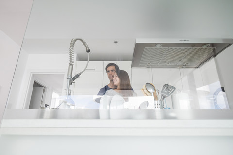 Young couple in modern kitchen stock photo