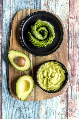 Bowl of guacamole and avocado stock photo