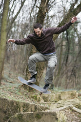 Skateboarder doing a trick - MOMF00050