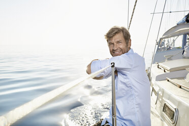 Portrait of smiling mature man on his sailing boat - PDF01165