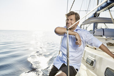 Portrait of smiling mature man on his sailing boat - PDF01166