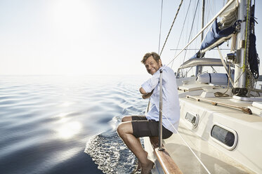 Portrait of smiling mature man on his sailing boat - PDF01167
