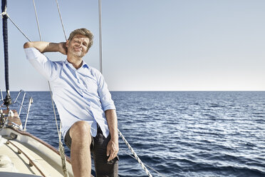 Portrait of smiling mature man on his sailing boat - PDF01186