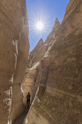 USA, New Mexico, Pajarito Plateau, Sandoval County, Kasha-Katuwe Tent Rocks National Monument, tourist in slot canyon - FOF09190