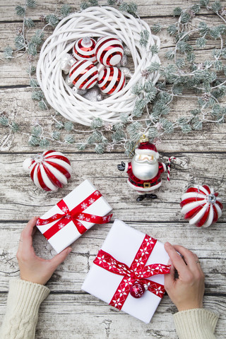 Hands holding Christmas presents stock photo