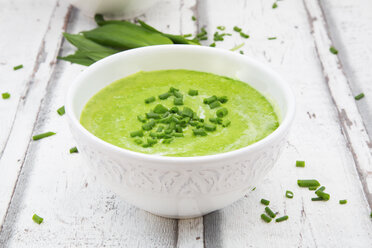 Bowl of ramson soup garnished with chives and cream - LVF06046
