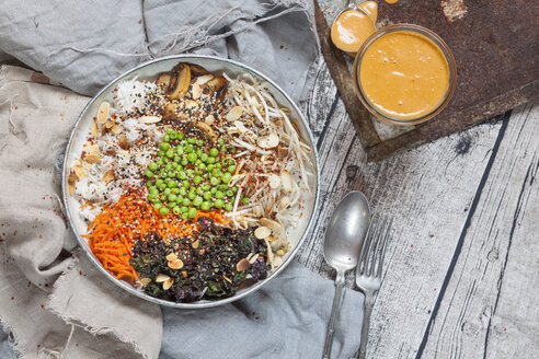Buddha bowl of kalette, carrot, mung bean sprouts, rice, peas, button mushrooms, and roasted almonds - SBDF03170