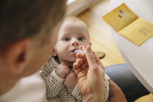 Three-month-old baby receiving oral vaccination - MFF03482