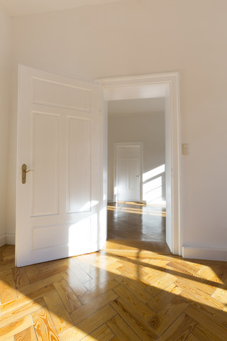 Spacious empty flat with herringbone parquet stock photo