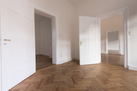 Spacious empty flat with herringbone parquet stock photo