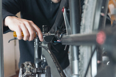 Bicycle mechanic changing rear suspension - SKCF00289