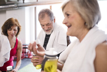 Group of fit seniors in gym taking a break - HAPF01460