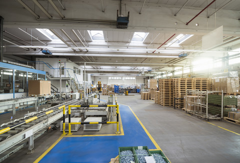 Conveyor belt in factory shop floor stock photo