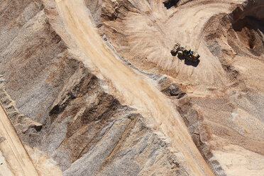 USA, Texas, aerial view of sand mine near San Antonio with a grader moving sand - BCDF00270