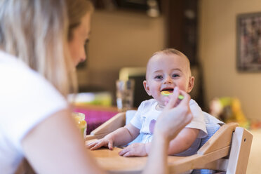 Mother feeding her baby son at home - DIGF01985