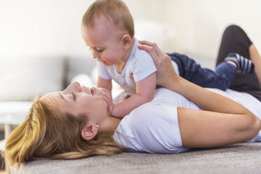 Mother and baby son playing at home - DIGF01992