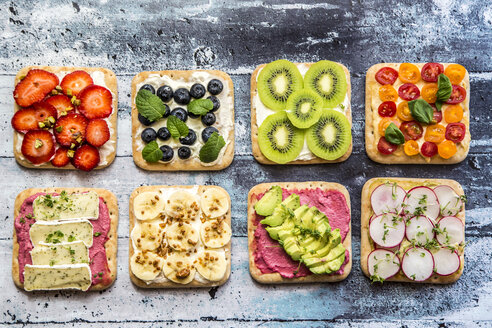 Two rows of various garnished sandwiches - SARF03303