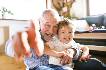 Grandfather and grandson having fun at home - HAPF01498