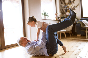 Grandfather and grandson having fun at home - HAPF01500