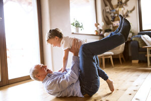 Grandfather and grandson having fun at home - HAPF01500