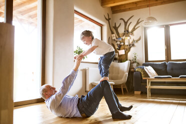 Grandfather and grandson having fun at home - HAPF01501