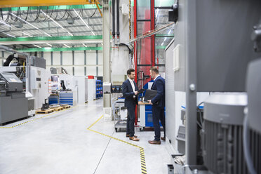 Two businessmen in factory shop floor - DIGF02068