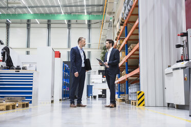 Two businessmen in factory shop floor - DIGF02070