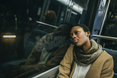 Portrait of young woman in underground train - KIJF01406