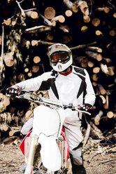 Italy, Motocross biker rinding in Tuscan forest - FMOF00216