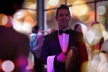 Smiling elegant waiter in tuxedo on a party - ZEF13570