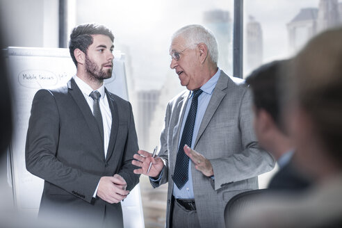 Two businessmen talking in city office - ZEF13638