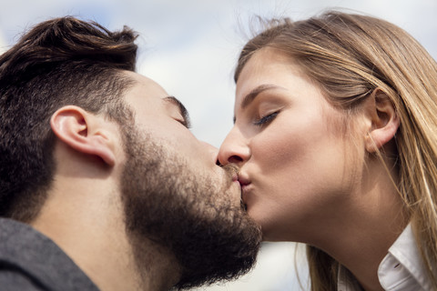 Young couple kissing stock photo